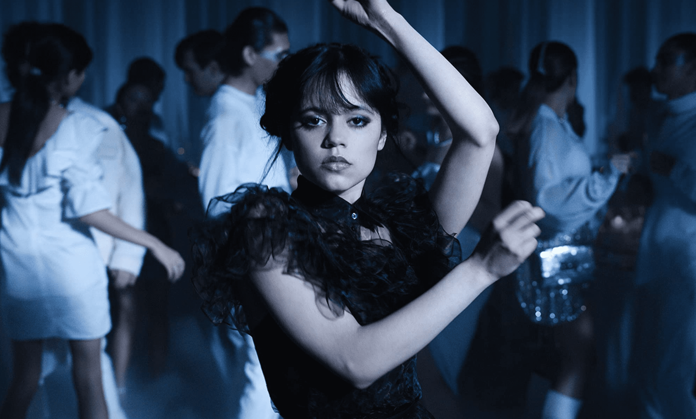 A girl in a black dress dances in this image from Netflix